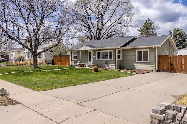 single story home with a gate, fence, a front yard, and a shingled roof