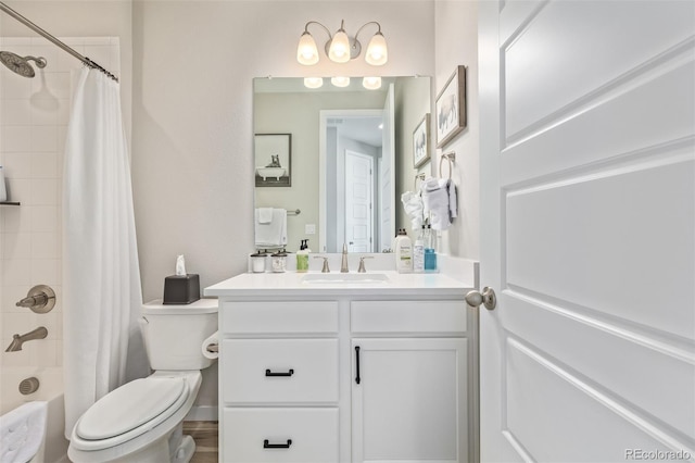 bathroom featuring shower / tub combo, toilet, and vanity