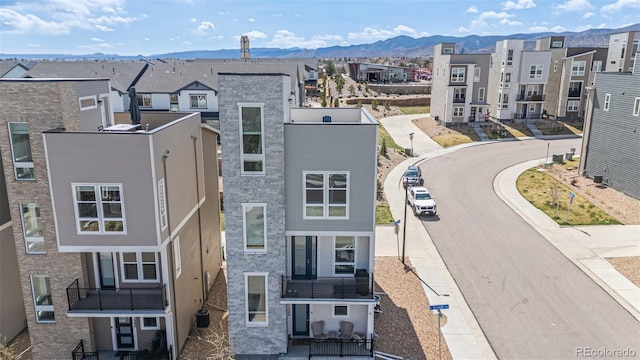 aerial view featuring a mountain view and a residential view