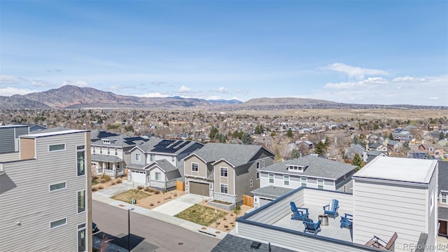 birds eye view of property featuring a mountain view and a residential view