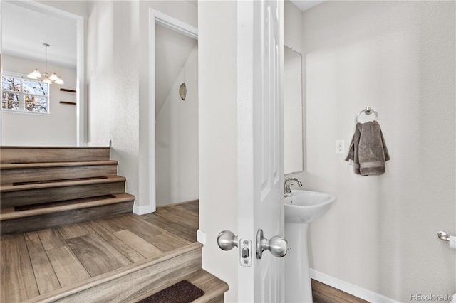 bathroom with a chandelier