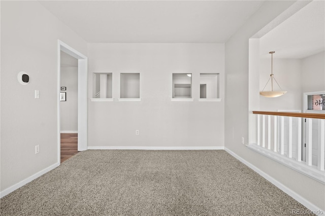 spare room featuring carpet floors