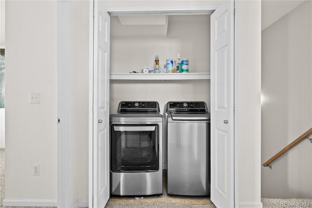 washroom with washing machine and dryer