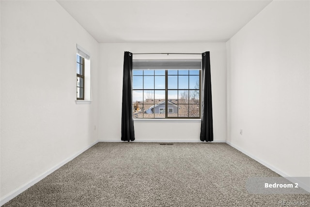 unfurnished room with carpet