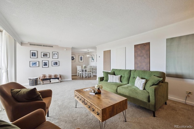 carpeted living room with visible vents, ornamental molding, a textured ceiling, and baseboards