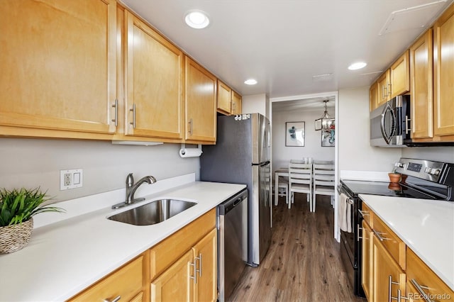 kitchen featuring a sink, appliances with stainless steel finishes, recessed lighting, and light countertops