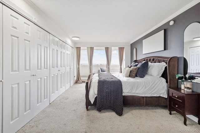 bedroom featuring light colored carpet, arched walkways, and crown molding