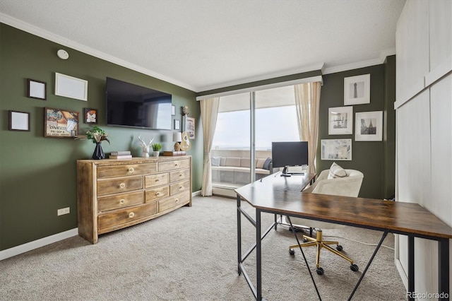 office featuring crown molding, carpet flooring, floor to ceiling windows, and baseboards