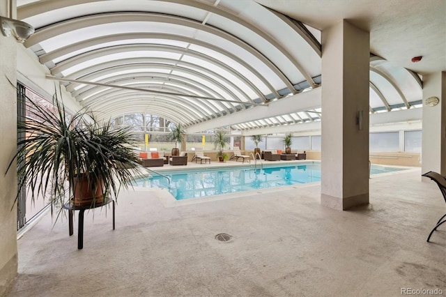 pool featuring a patio, outdoor lounge area, fence, and a pergola