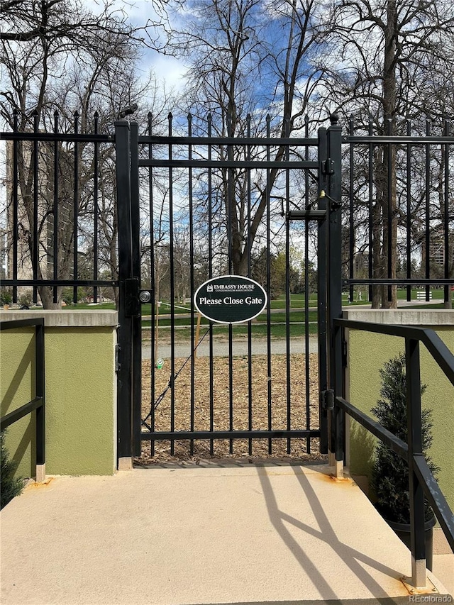 view of gate with fence