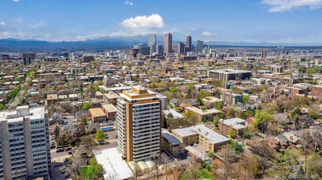 birds eye view of property with a mountain view and a city view