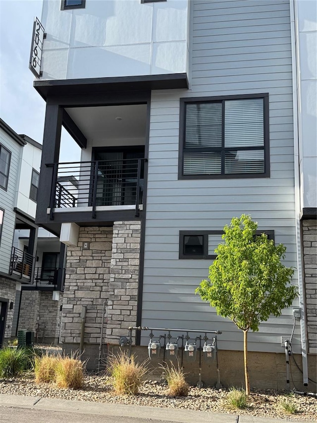 view of property exterior with a balcony