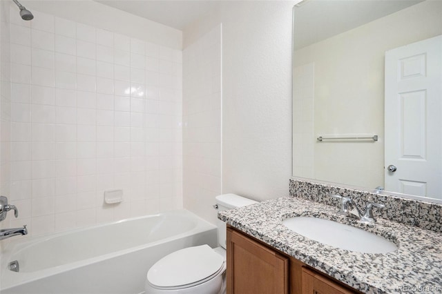 bathroom with toilet, vanity, and shower / bathing tub combination