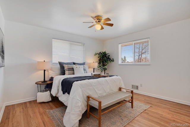 bedroom with light hardwood / wood-style flooring and ceiling fan