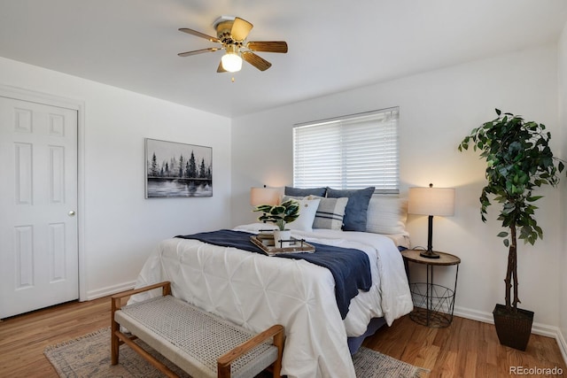 bedroom featuring hardwood / wood-style floors and ceiling fan