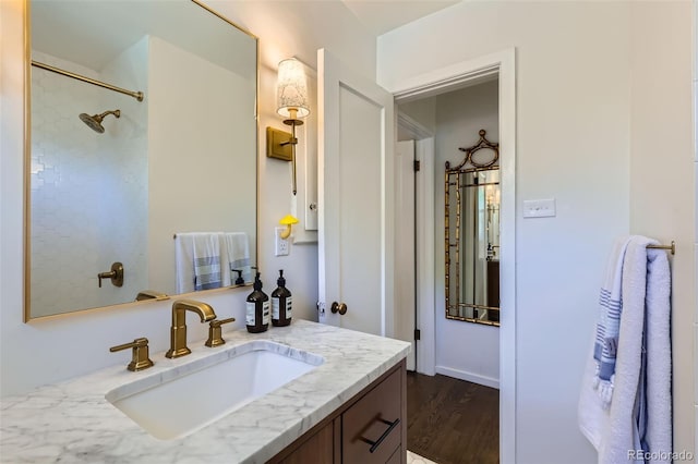 bathroom featuring wood finished floors and vanity