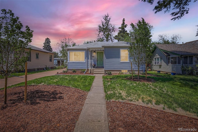 view of front of house featuring a lawn