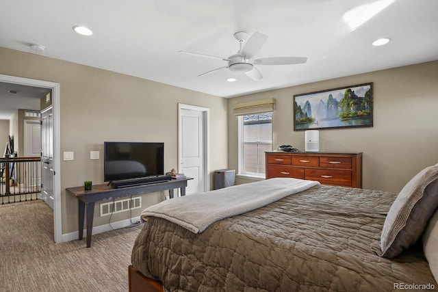 bedroom featuring light colored carpet and ceiling fan