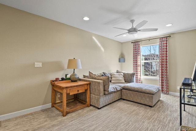 living room featuring light carpet and ceiling fan