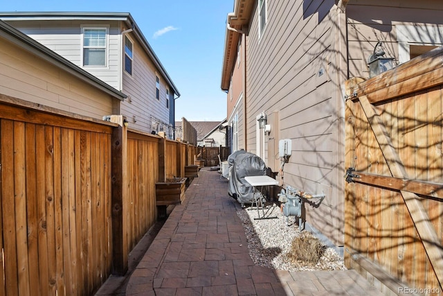 view of side of home featuring a patio