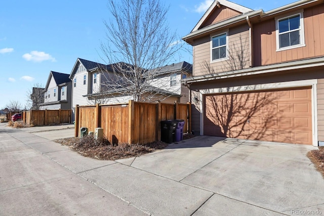 view of side of home with a garage