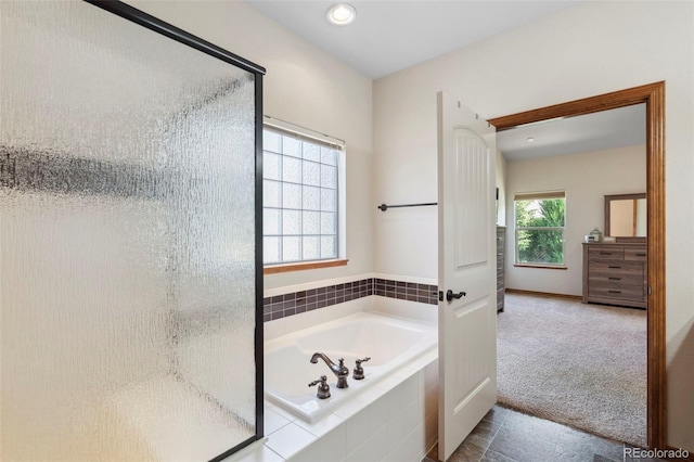 641 Denali Ct, Windsor, CO 80550 - bathroom with a shower stall, a garden tub, recessed lighting, and baseboards