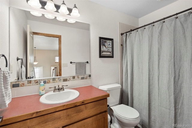 641 Denali Ct, Windsor, CO 80550 - bathroom with backsplash, toilet, vanity, and a shower with curtain