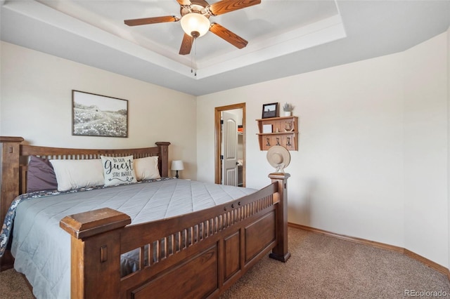 641 Denali Ct, Windsor, CO 80550 - bedroom featuring light colored carpet, baseboards, a walk in closet, and a ceiling fan