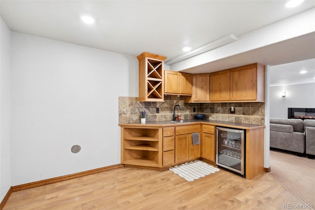 641 Denali Ct, Windsor, CO 80550 - kitchen featuring beverage cooler, open shelves, a sink, decorative backsplash, and light wood-type flooring