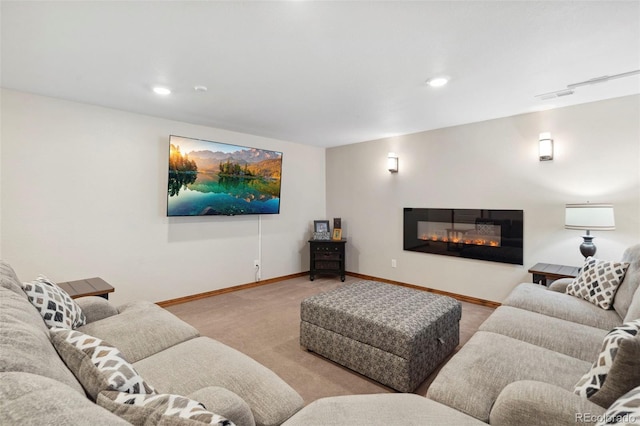 641 Denali Ct, Windsor, CO 80550 - living room featuring light colored carpet, baseboards, a glass covered fireplace, and recessed lighting