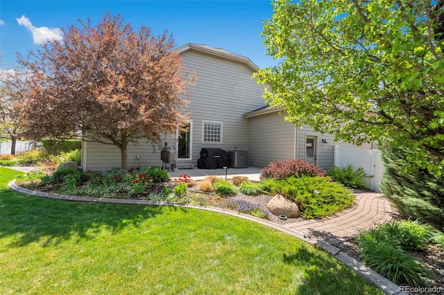 641 Denali Ct, Windsor, CO 80550 - rear view of house with a patio and central air condition unit