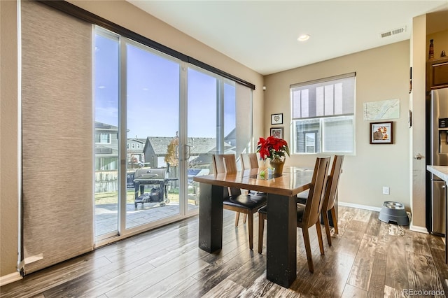 dining area with hardwood / wood-style floors