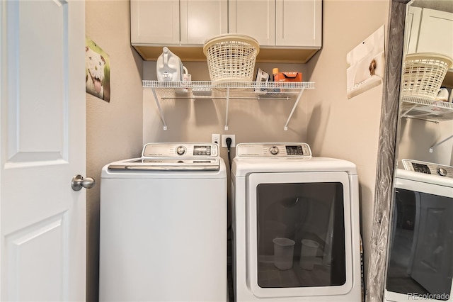 laundry room with cabinets and independent washer and dryer