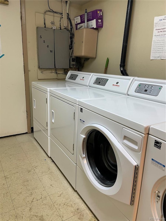 washroom with washing machine and dryer