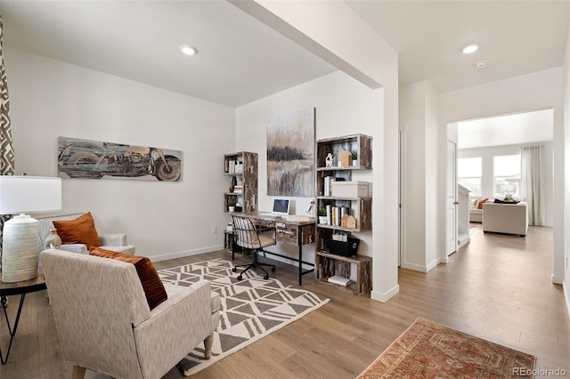 office with wood finished floors, baseboards, and recessed lighting