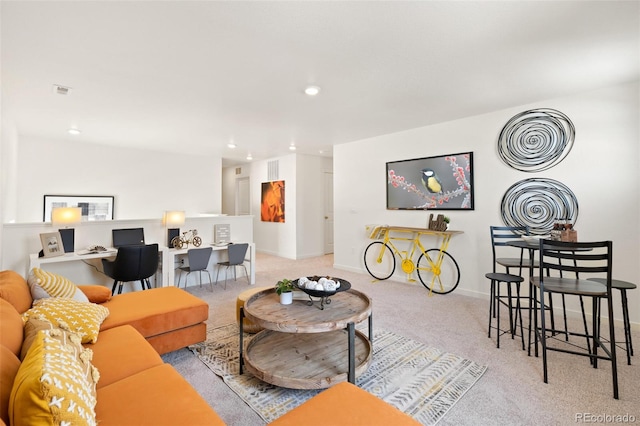 living area featuring carpet flooring, recessed lighting, and baseboards