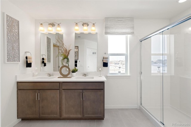 bathroom featuring baseboards, a shower stall, and tile patterned floors