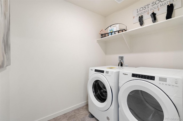 laundry room featuring washer and clothes dryer and baseboards