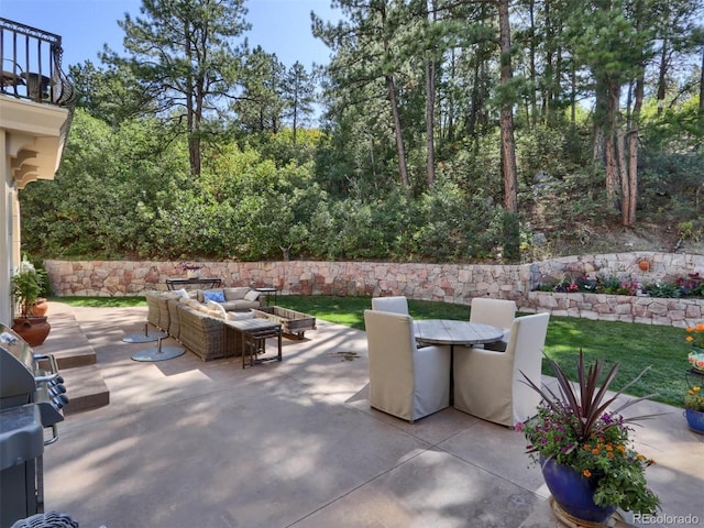 view of patio with outdoor lounge area and grilling area