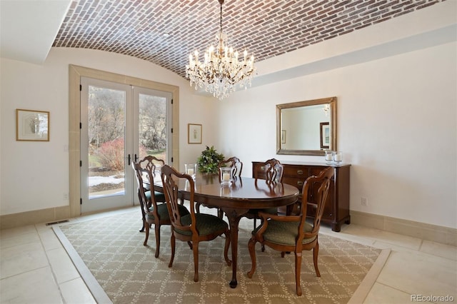 dining space featuring french doors, brick ceiling, tile patterned floors, vaulted ceiling, and a notable chandelier