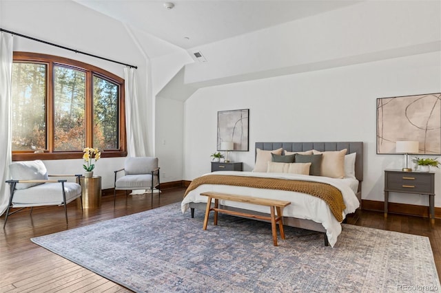 bedroom featuring dark hardwood / wood-style floors and vaulted ceiling