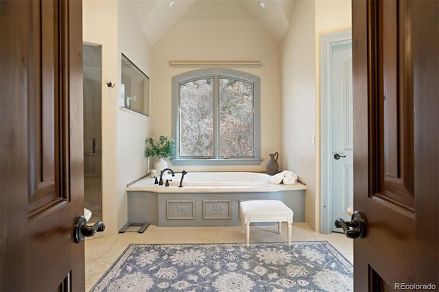 bathroom featuring tile patterned flooring and a bathtub