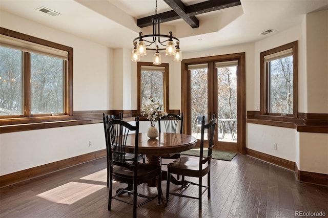 dining area with coffered ceiling, a chandelier, dark hardwood / wood-style floors, and beamed ceiling