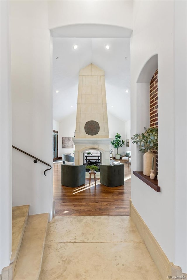 hallway with high vaulted ceiling