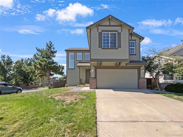 view of front of house with a front yard and a garage