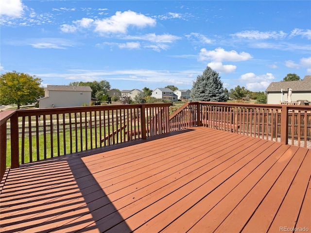 wooden deck with a yard