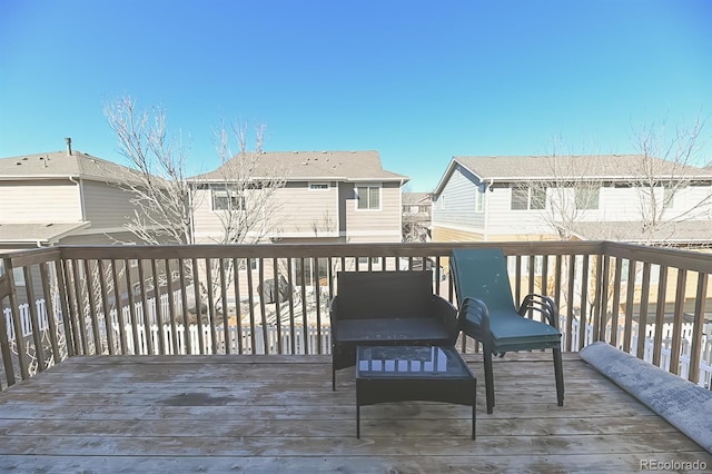 wooden deck with a residential view