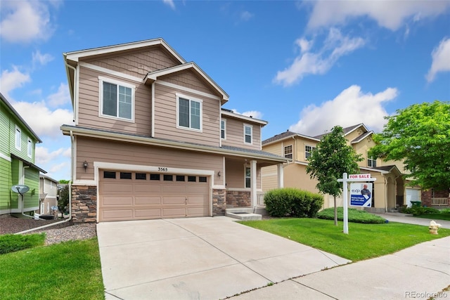 3565 E 141st Dr, Thornton, CO 80602 - craftsman-style home with a garage, a front yard, concrete driveway, and stone siding