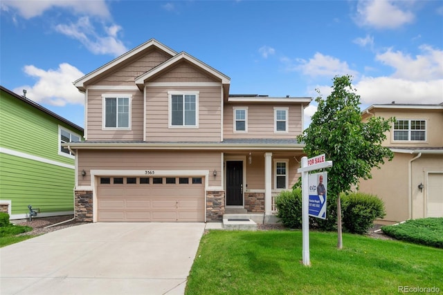 3565 E 141st Dr, Thornton, CO 80602 - craftsman inspired home with a front yard, a garage, driveway, and stone siding