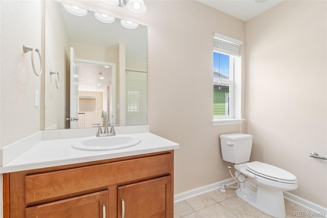 3565 E 141st Dr, Thornton, CO 80602 - full bathroom with baseboards, toilet, vanity, and tile patterned flooring